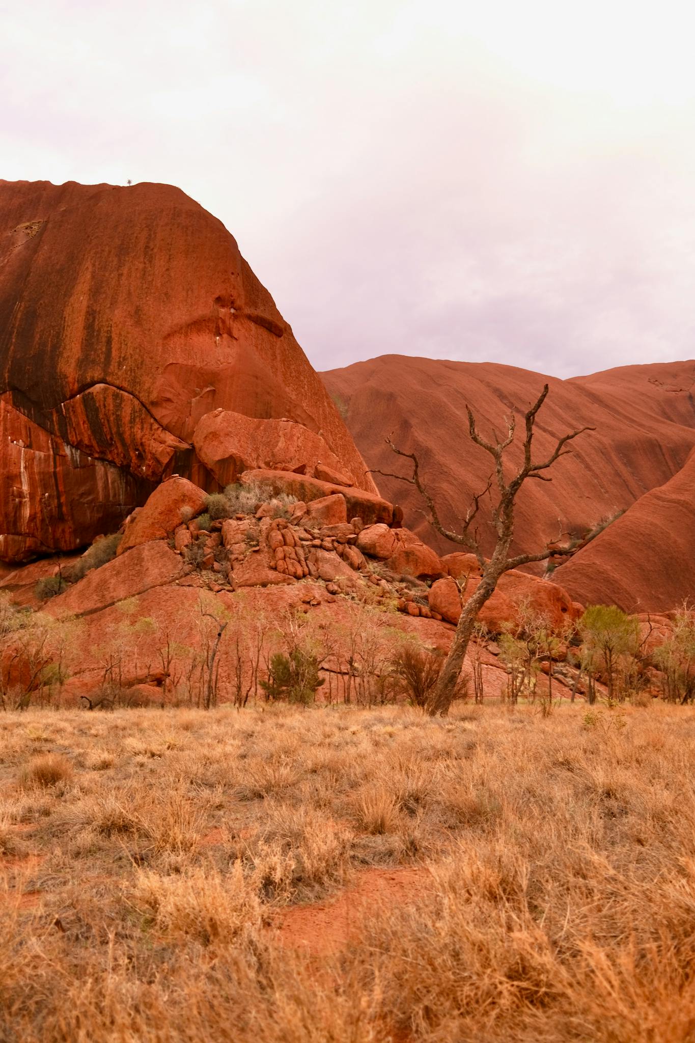 A scenic view of the iconic red rock formation at Uluru, Australia.